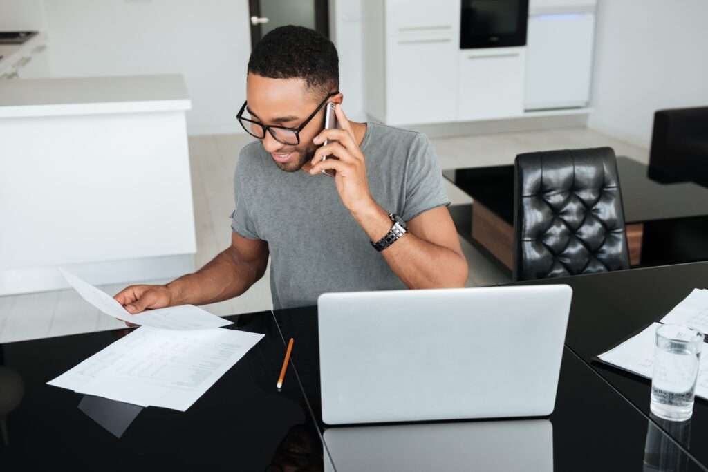 Happy,African,Man,Dressed,In,Grey,T-shirt,And,Wearing,Eyeglasses